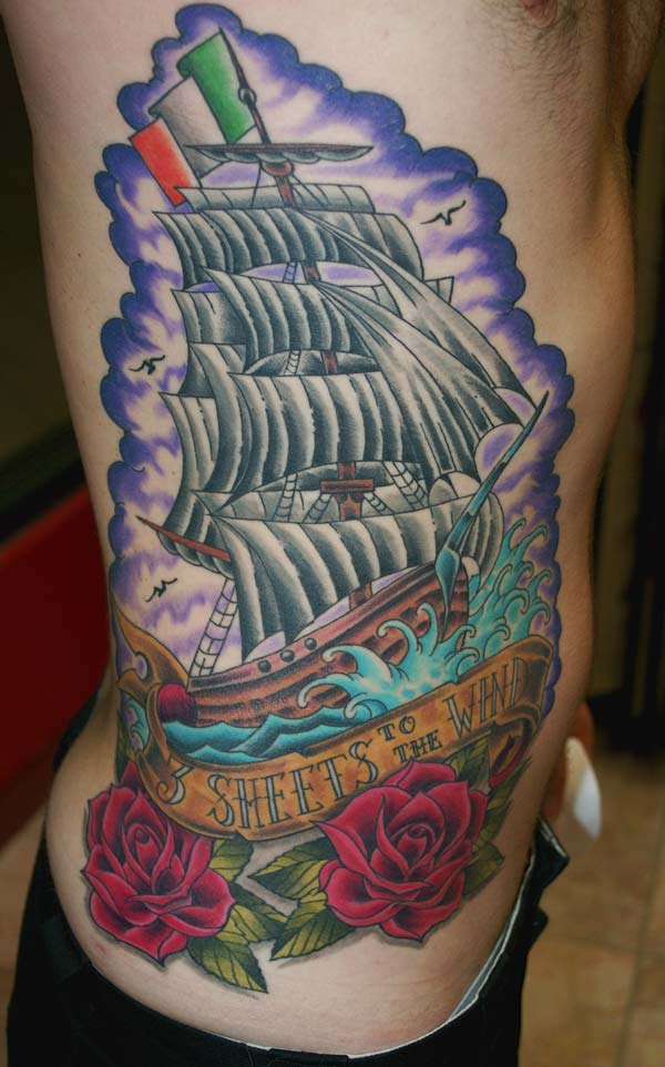 of tattoos. Elvy's back features a clipper ship, 3 sheets to the wind ship.